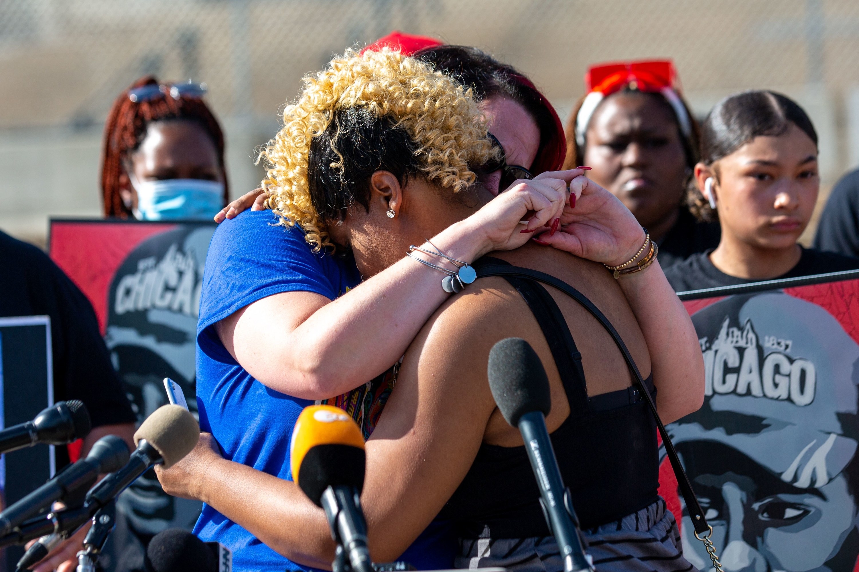 Courteney Ross, the fiancé of George Floyd, hugs Toshira Garraway during a remembrance event and call for justice for those who lost loved ones to police violence outside the Minnesota State Capitol on May 24, 2021, in St. Paul