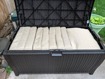 the storage bench with pillows inside