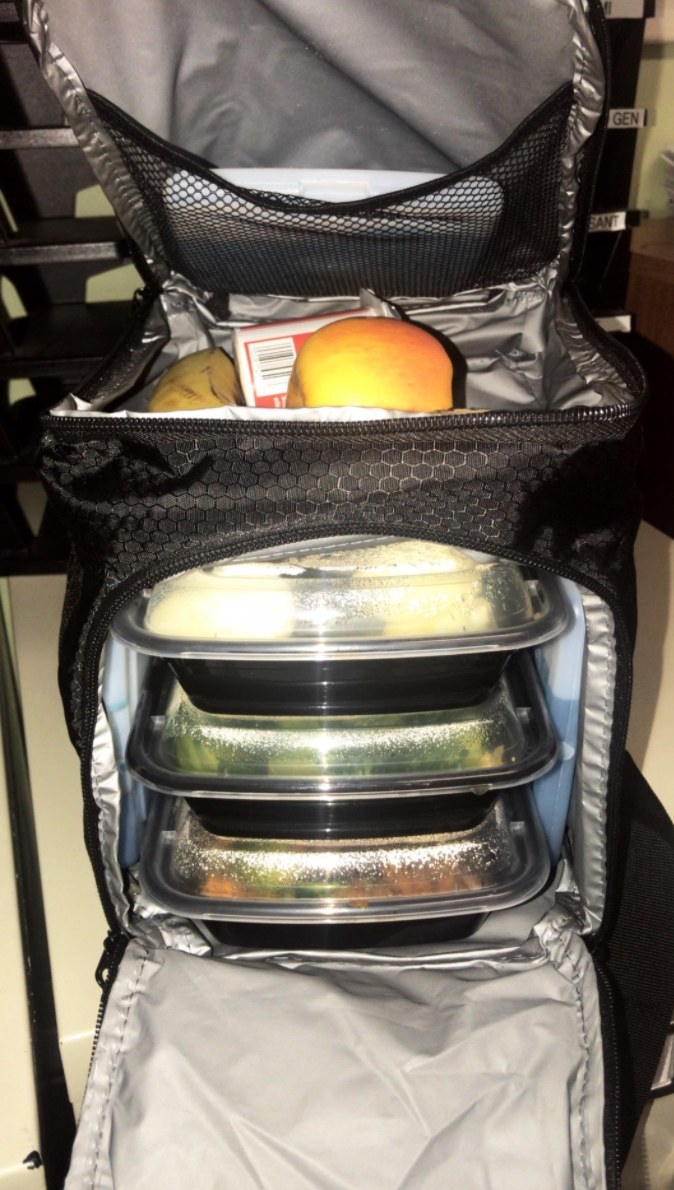 The insulated meal prep bag holding plastic containers full of meals
