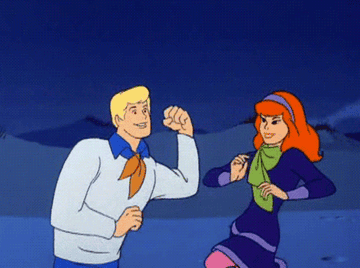 Fred and Daphne from Scooby Doo dancing
