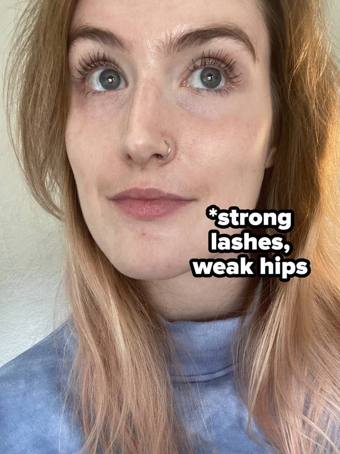 a selfie of me wearing mascara with the text "strong lashes, weak hips"