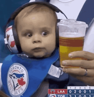 An animated GIF baby staring at a beer glass.