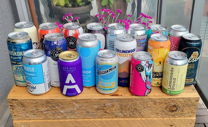 A bunch of beers sitting on top of a piece of wood.