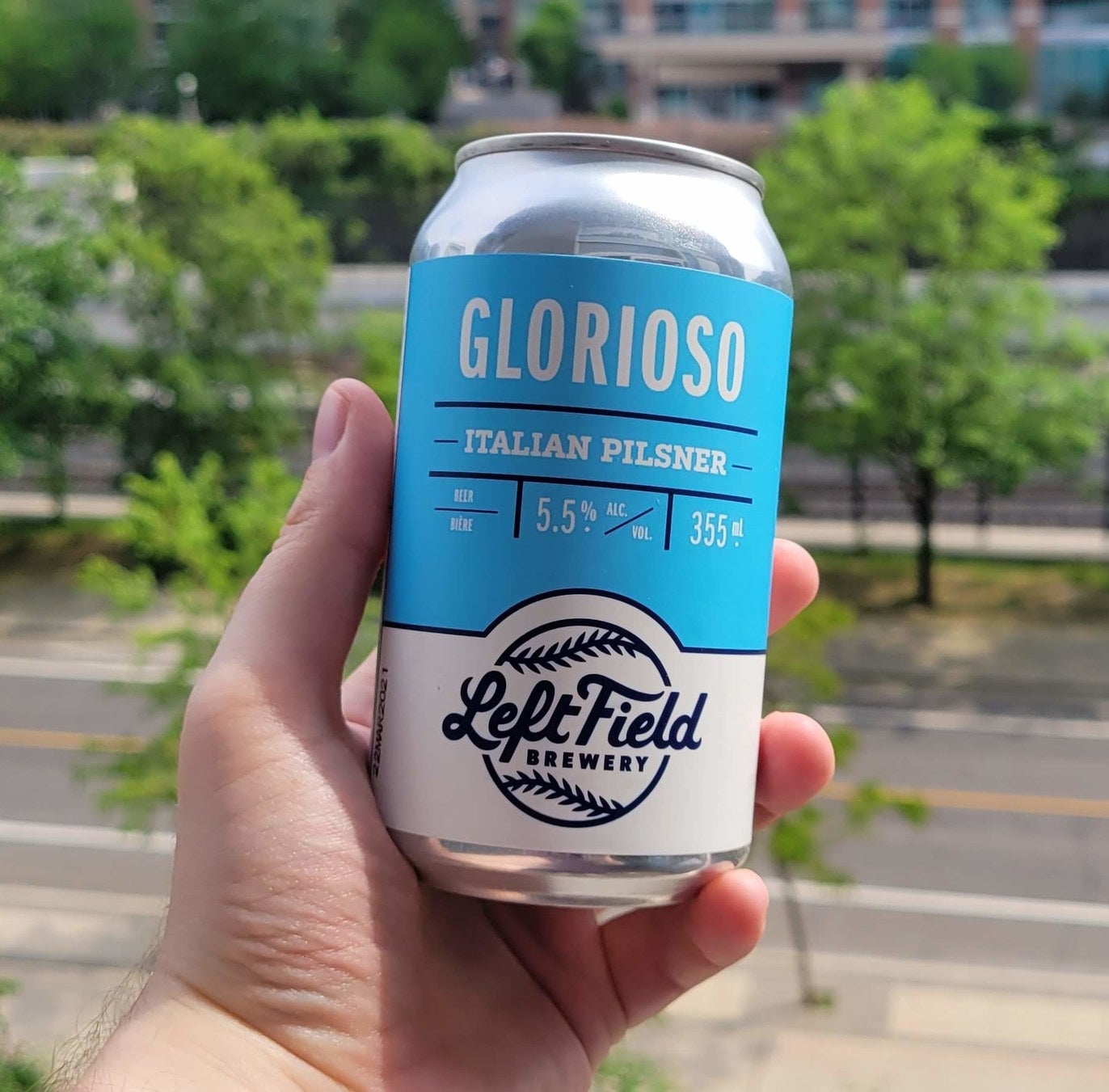 A can of Glorioso being held in a hand.