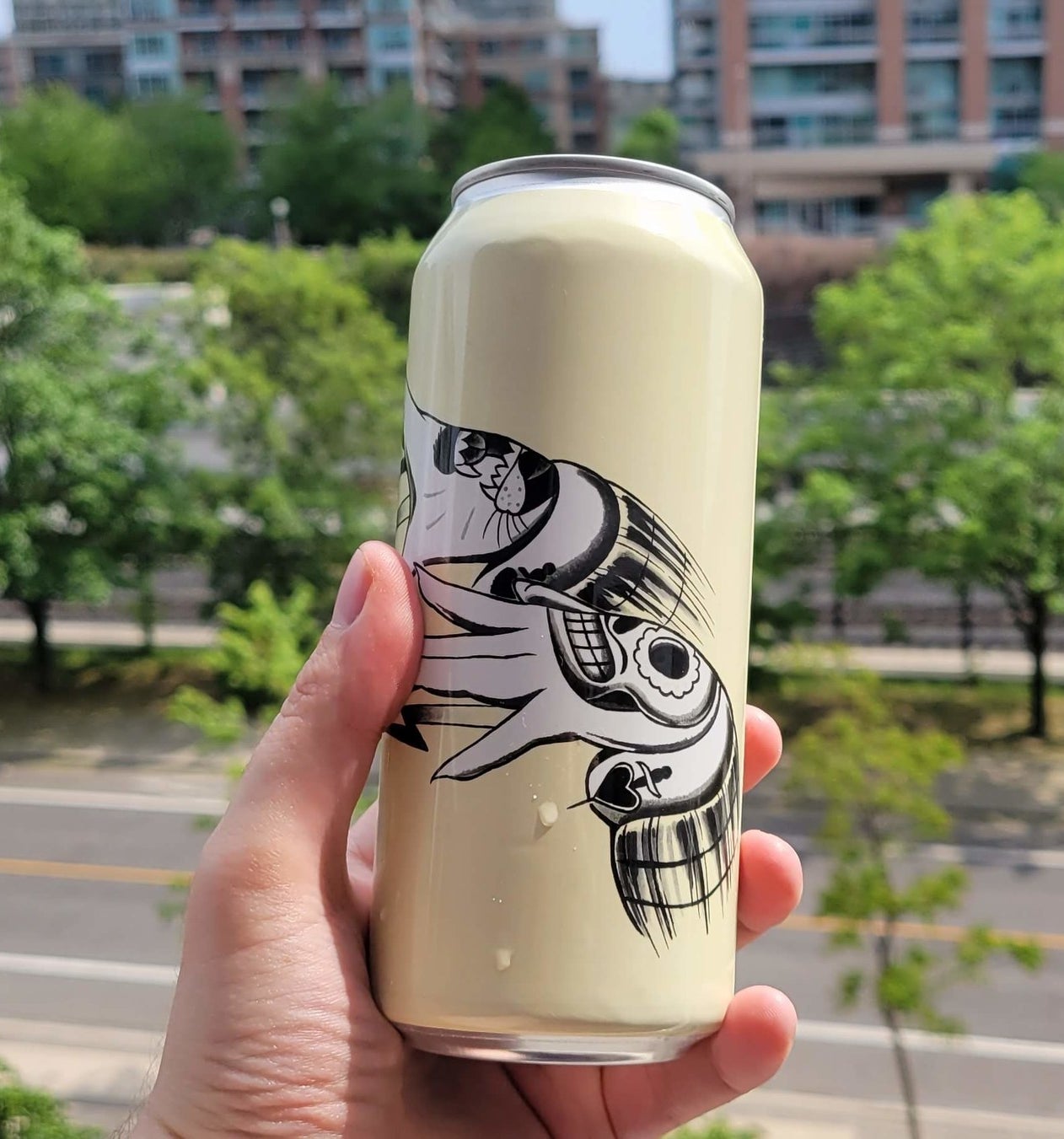 A can of Earl Grey Wheat being held in a hand.