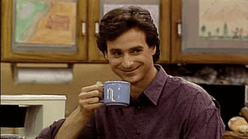 Bob Saget nodding with a cup of coffee