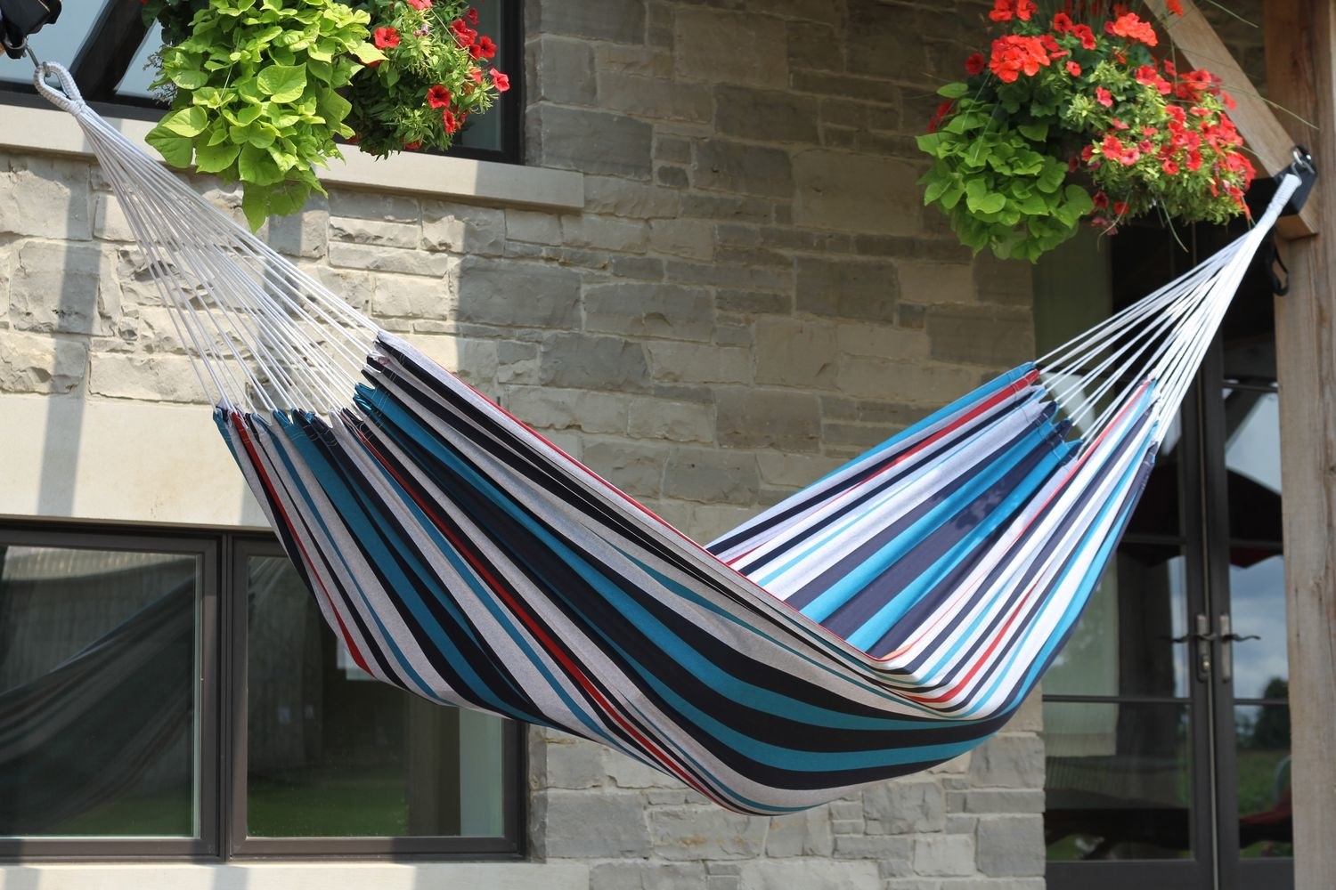 The hammock on a patio outside a house