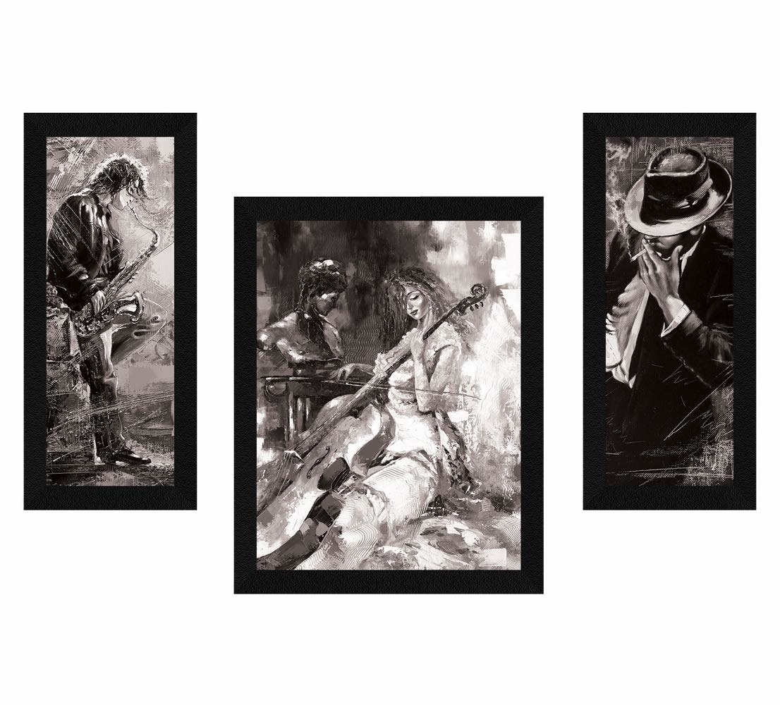 The black and white music-themed art prints in black frames