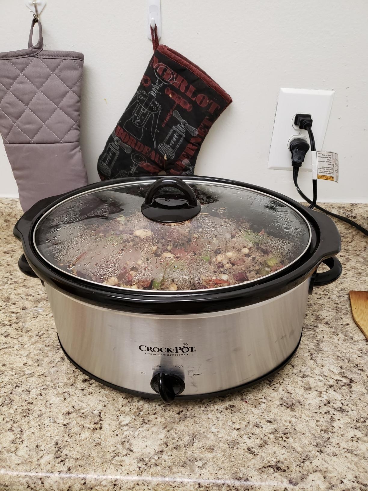 The Crock Pot cooking food on a kitchen counter