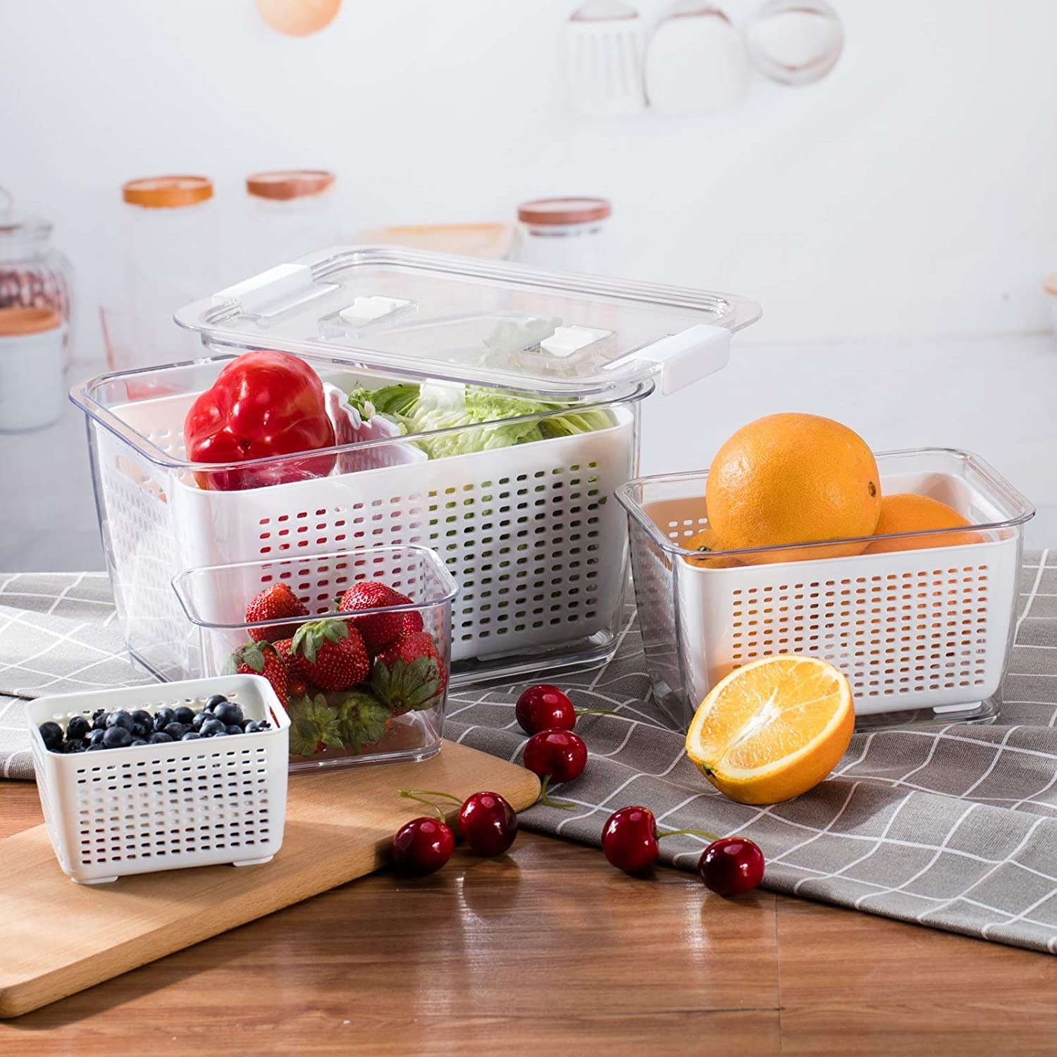 The three containers filled with fruits and veggies