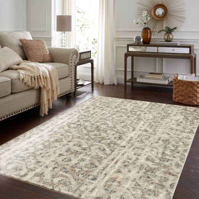 A grey, white, and brown rug in a home