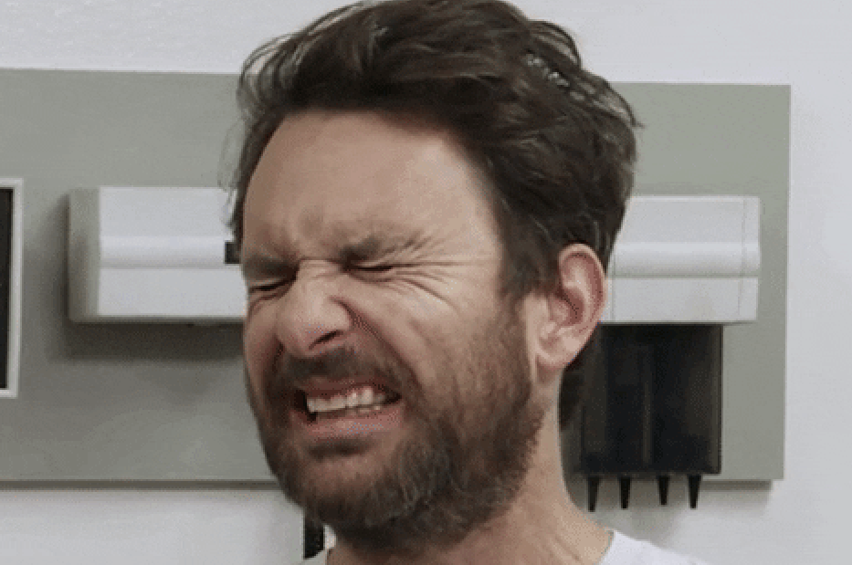 Charlie Day scrunching his face in disgust