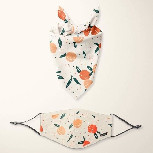 a matching bandanna and face mask set with a peaches print 