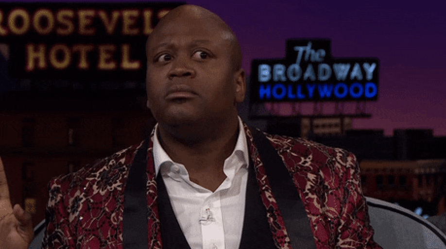 Tituss Burgess with wide eyes and nervous energy