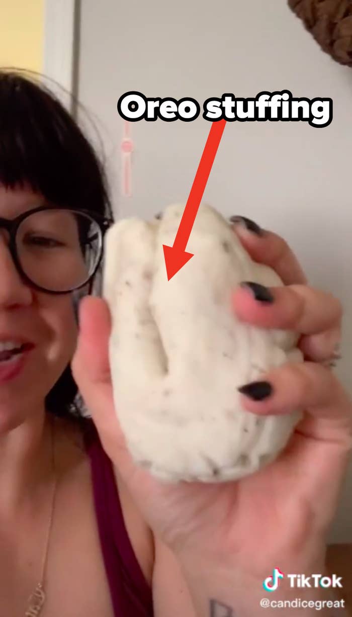 Person holding a baseball sized clump of Oreo stuffing