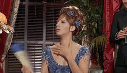 Barbara Streisand fanning herself in a gif from Funny Girl