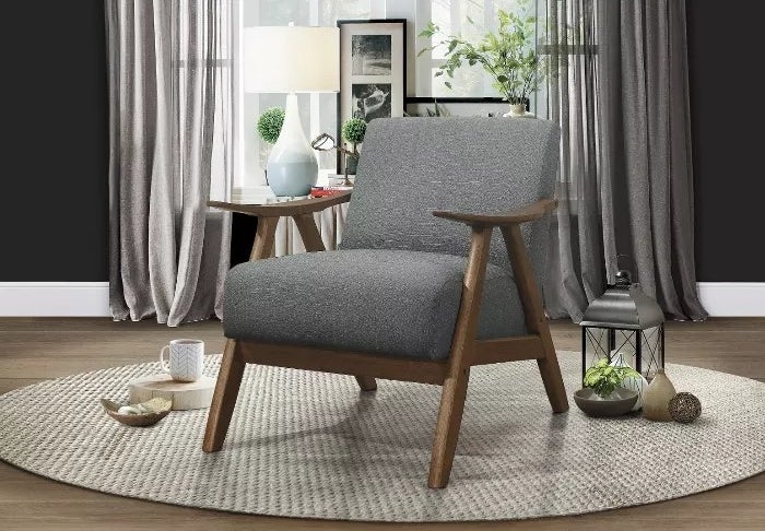 The armchair with gray upholstery