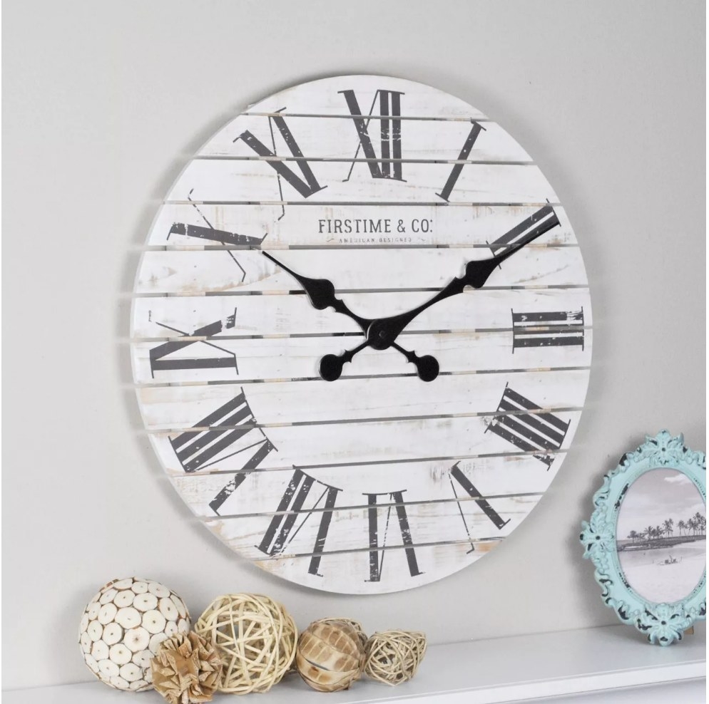 An 18&quot;, white and black, farmhouse wall clock