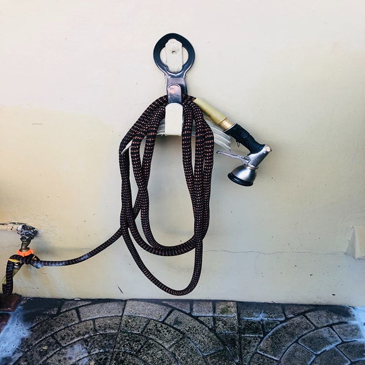 Reviewer's photo of hose hanging on wall