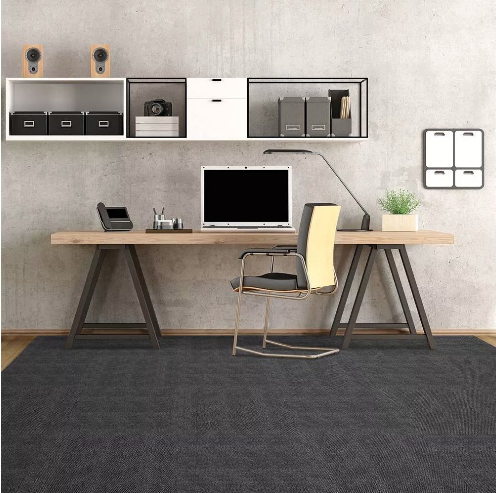 Gray, self-stick carpet tiles displayed in an office