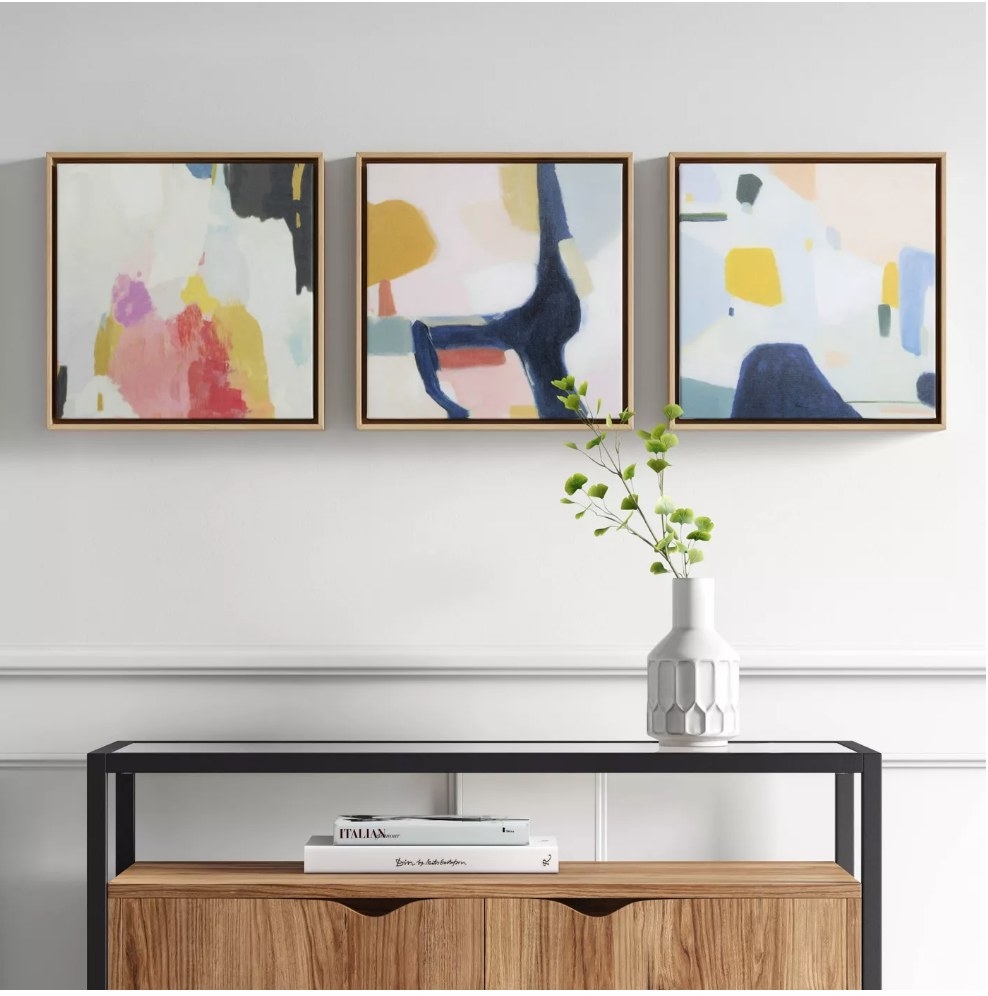 A set of 3, 12&quot; x 12&quot;, framed canvases with abstract, multi-colored art
