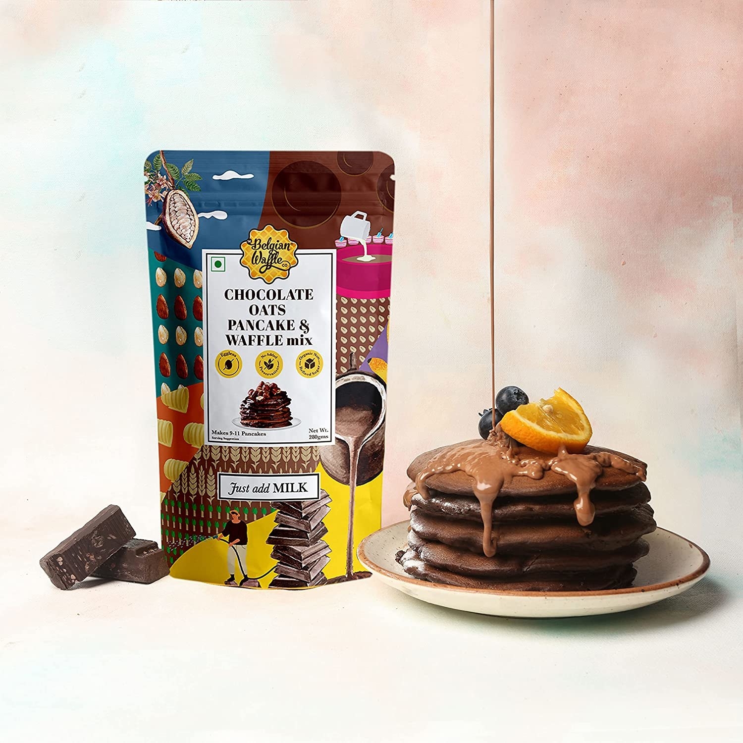 Packet of the Belgian chocolate pancakes next to the pancakes on a plate with chocolate being dripped over them