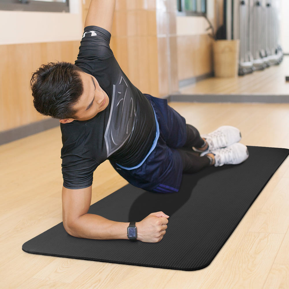 A person doing a side plank on the mat