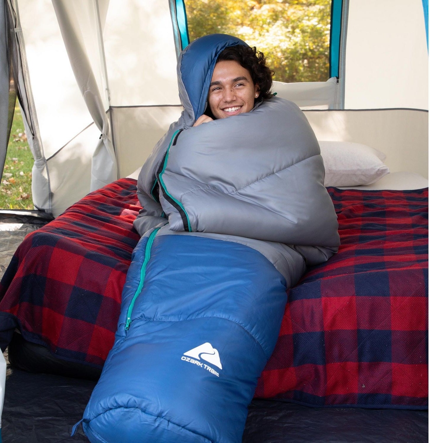 A person lying inside the sleeping bag