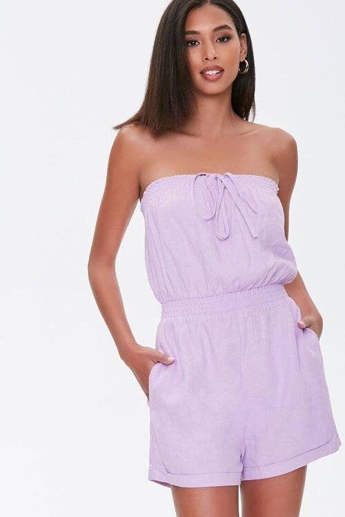 Model wearing lavender romper with an elastic waist, and tie detail in chest area