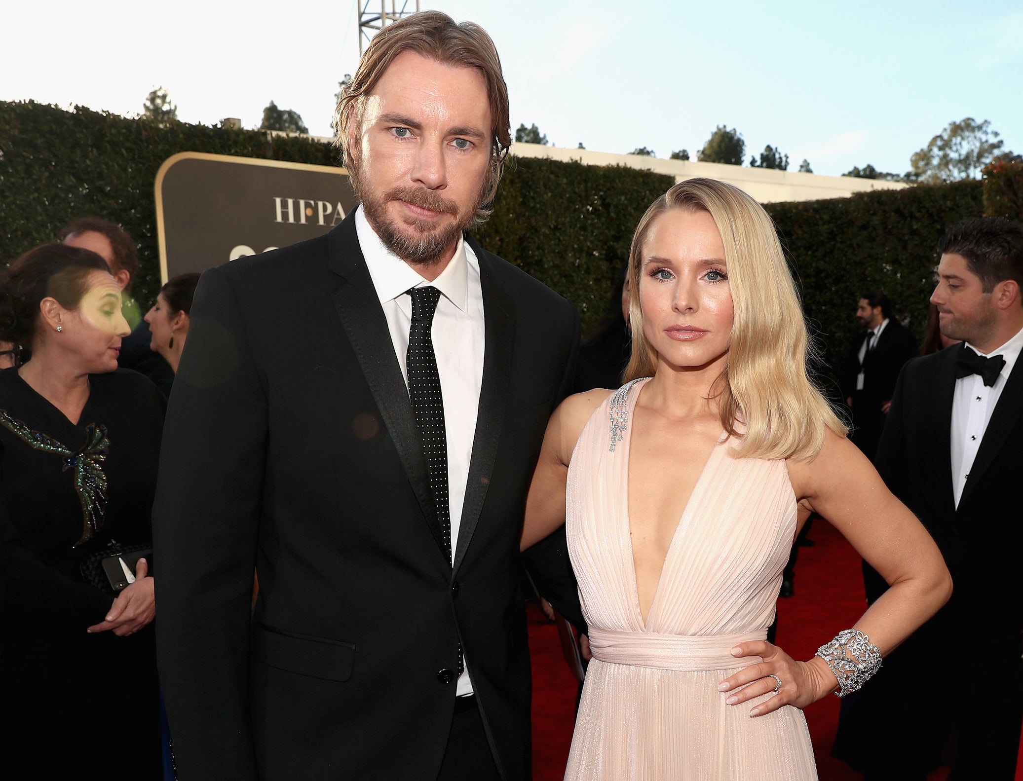 Kristen and Dax pose together at a red carpet event