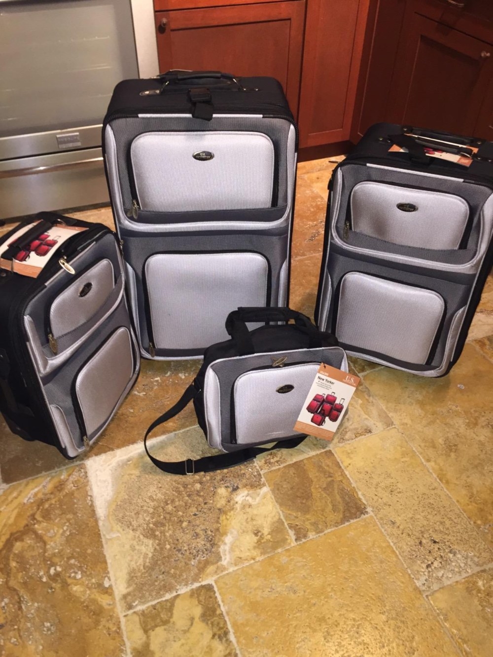 Reviewer&#x27;s photo of the suitcase set in the color Gray