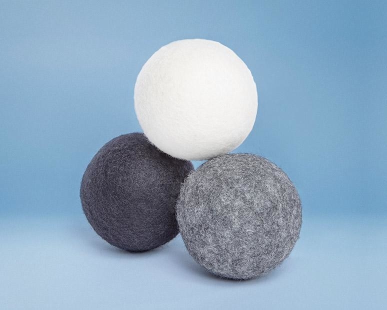 Dryer balls in white, black, and gray