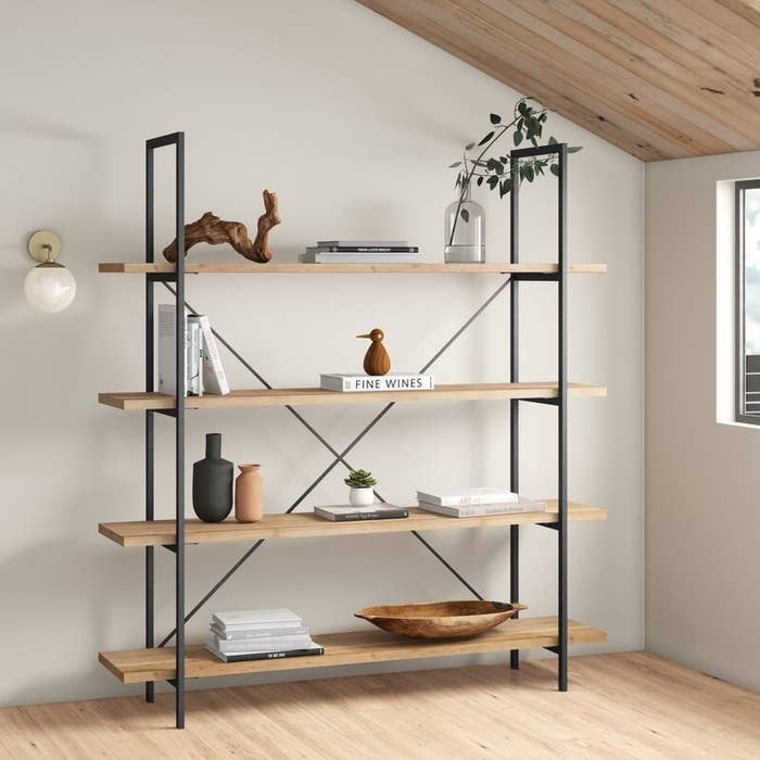 Bookcase with four shelves and black wooden frame