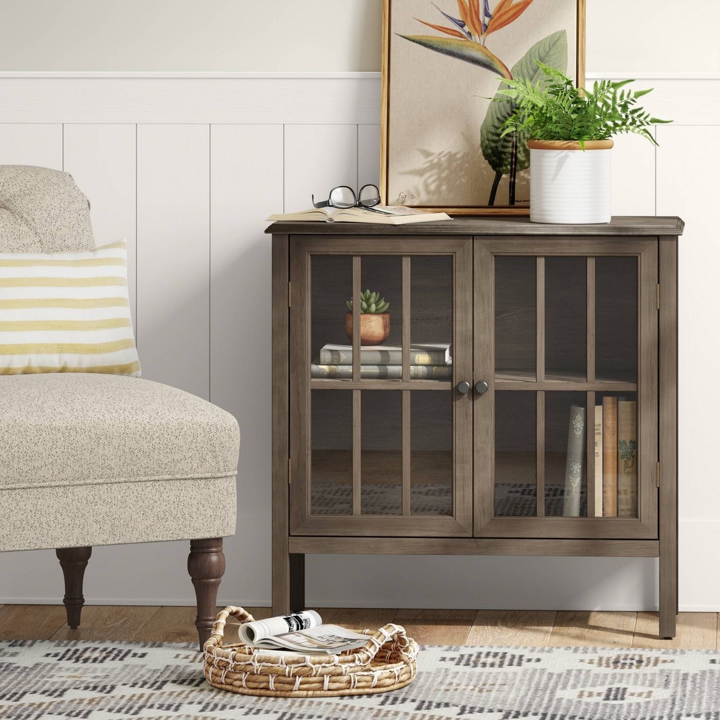 A brown two-door accent cabinet in a living room