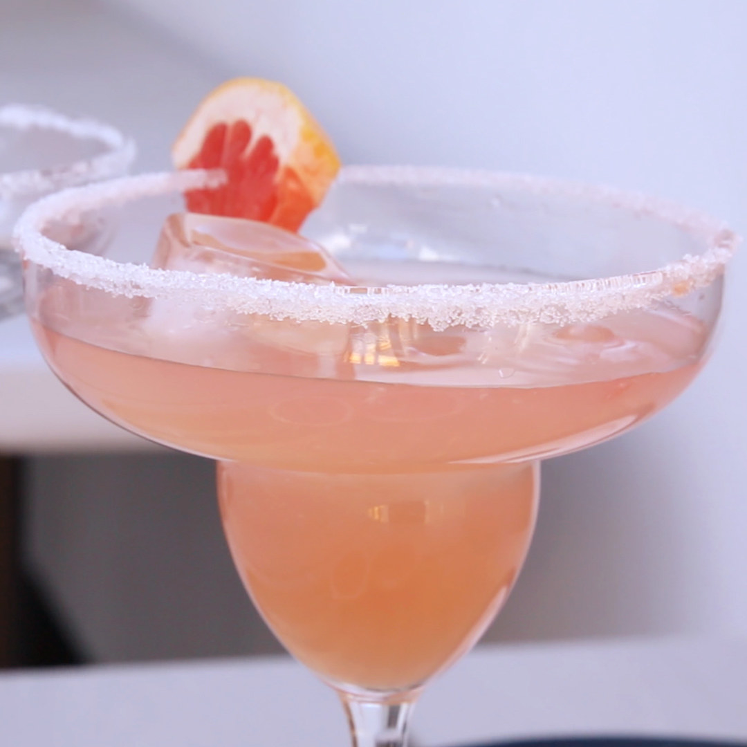 A pink grapefruit margarita with a salted rim.