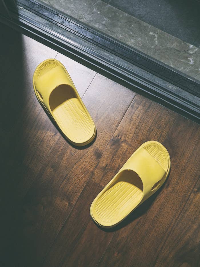 Yellow slippers in front of the balcony door