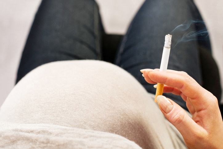 Getty image of a pregnant woman smoking