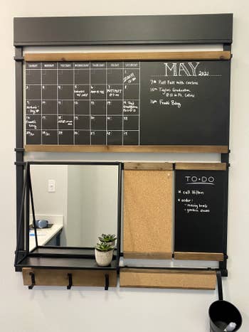 BuzzFeed writer Kayla Suazo's organizing board hung in home office with calendar, to-do list and cork board