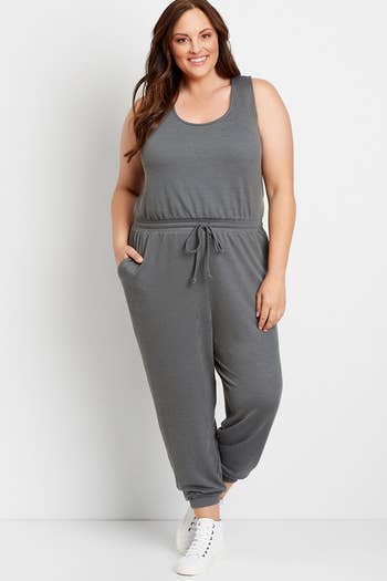 front view of a model wearing the sleeveless grey jumpsuit