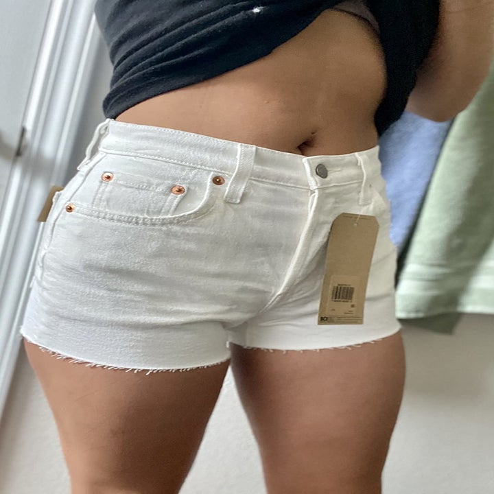 a reviewer wearing the shorts in white 