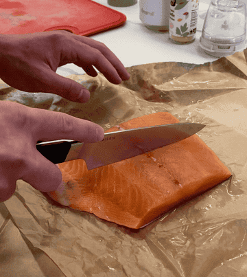 gif of person cutting through salmon with knife with ease