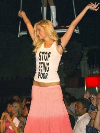 Paris Hilton wearing a &quot;Stop Being Poor&quot; tank