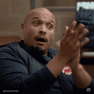 reaction gif of man clapping looking impressed