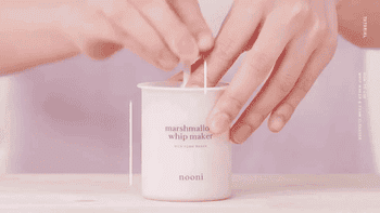 A gif of a model pumping the device to make the foam