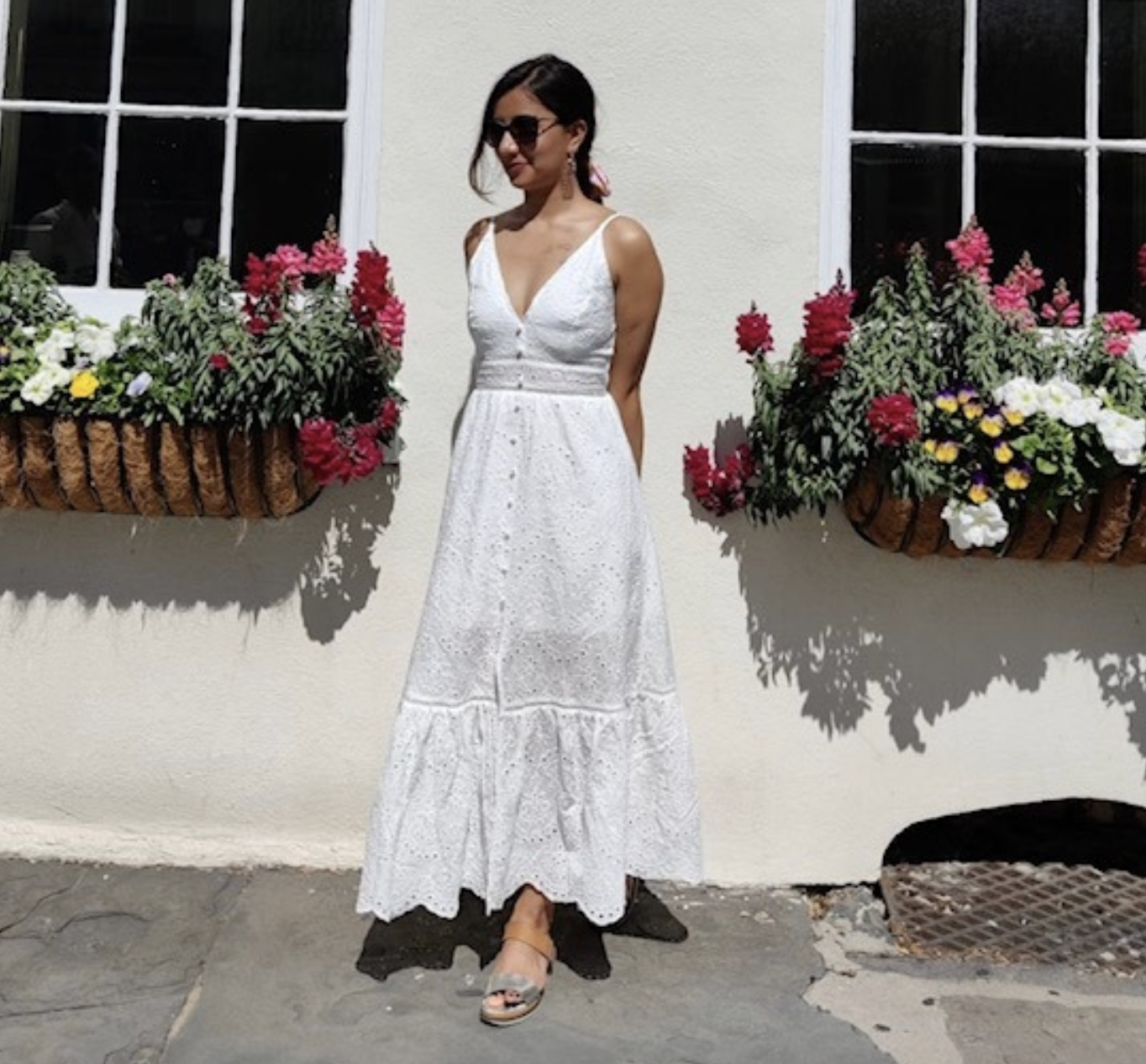 reviewer wearing the white maxi dress