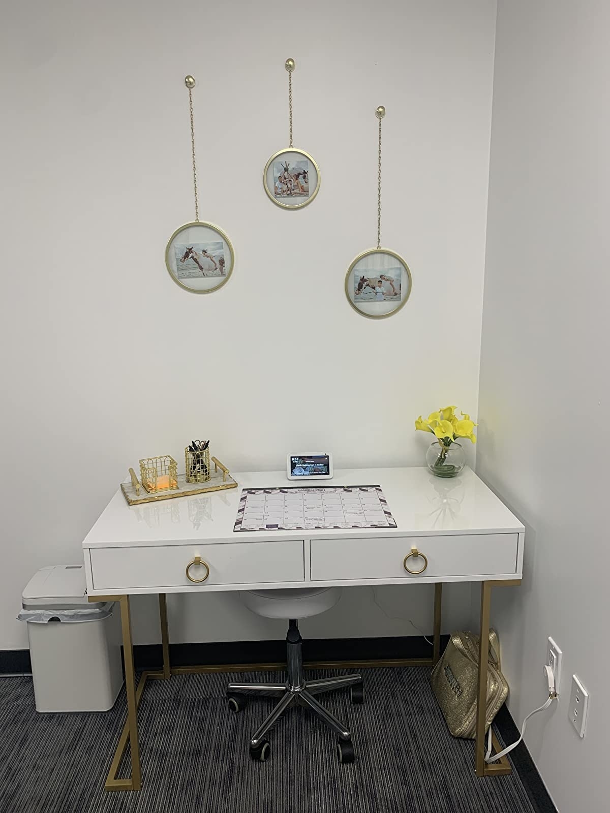 reviewer image of the three brass umbra fotochains hanging above a white and gold desk