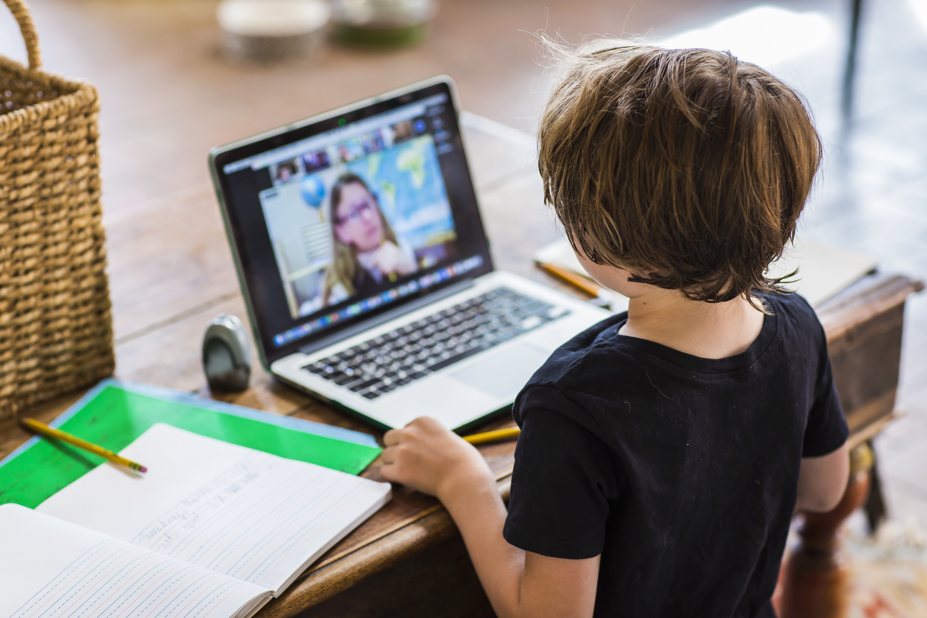 Photo of a child attending school online