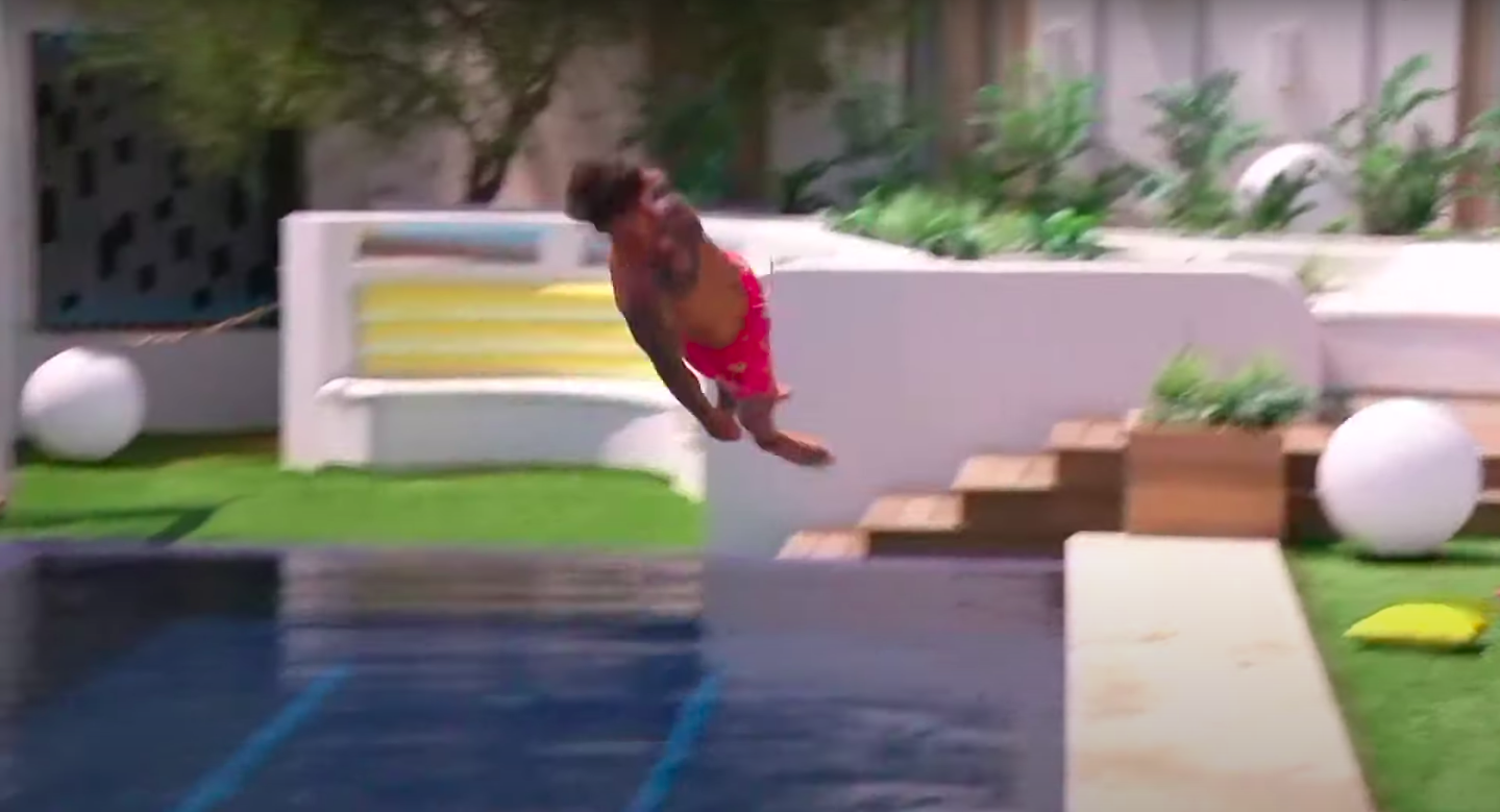 Chris with a totally straight body, jumping into the pool horizontally