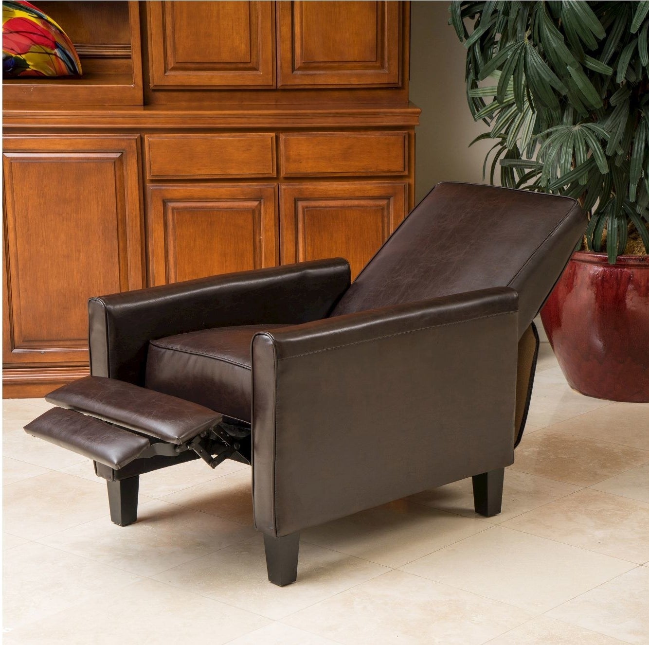 A brown reclining chair in a living room