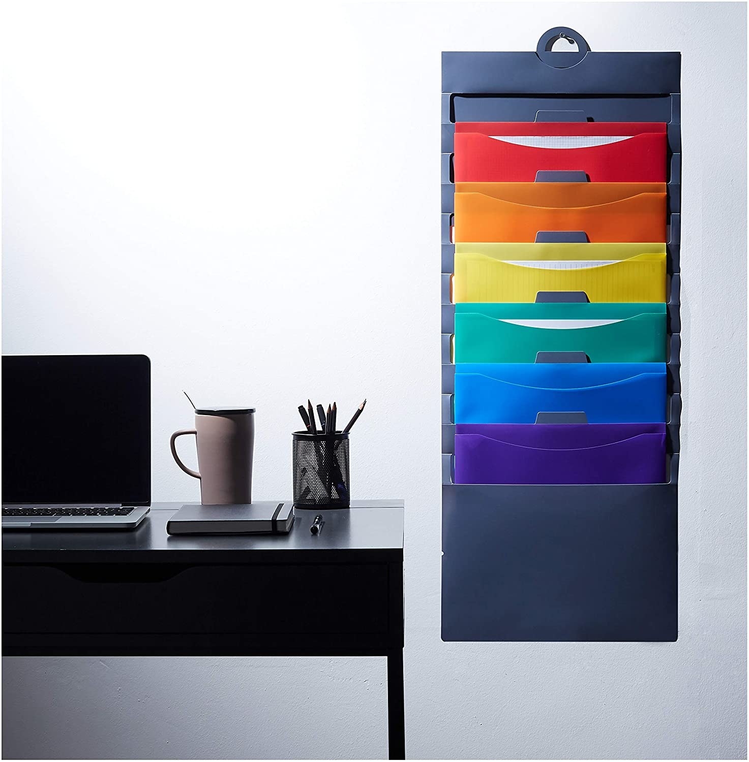 A cascading wall organiser with rainbow coloured tabs